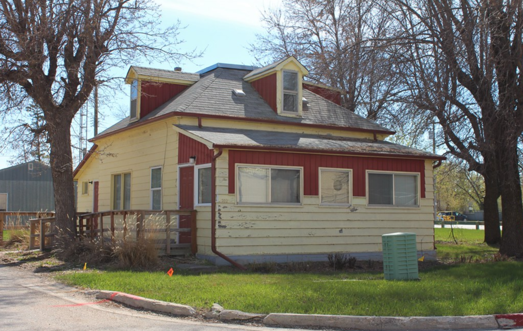 Coloured photo of an older home on Christie Avenue
