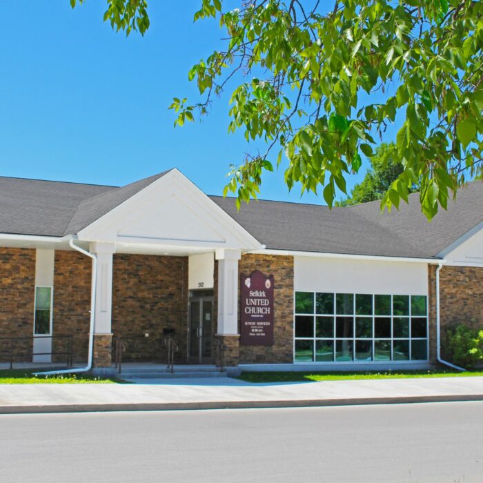 202 McLean Ave, 2020, Selkirk Museum Collection Colour image of a rectangular church with an entrance on the left side. There is a row of windows and then a large brick wall with a peaked roof.