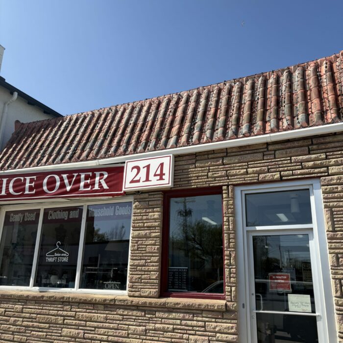 Colour photo of 214 Manitoba Ave. The building is brick with a red tile roof