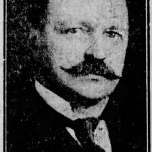 A headshot of A. A. Gilroy.