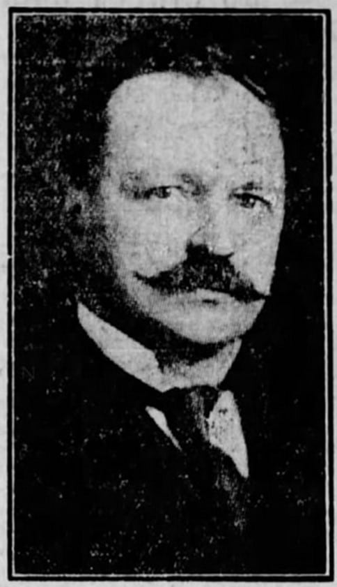 A headshot of A. A. Gilroy.