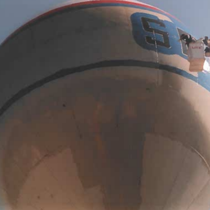 Colour photo of the water tower being painted