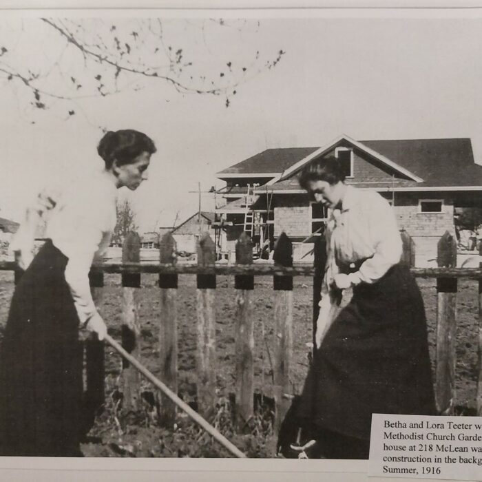 Betha and Lora Teeter at the Methodist Church Garden Next Door to Their House at 218 McLean Ave, 1916, Selkirk Museum Collection A black and white photo of two women working in the garden. In the background is a house and a picket fence
