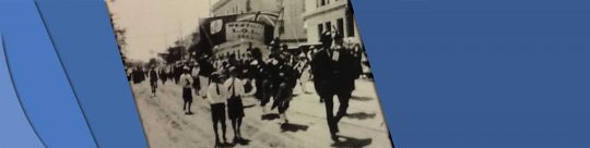 People walking down Britannia Avenue in black and white.