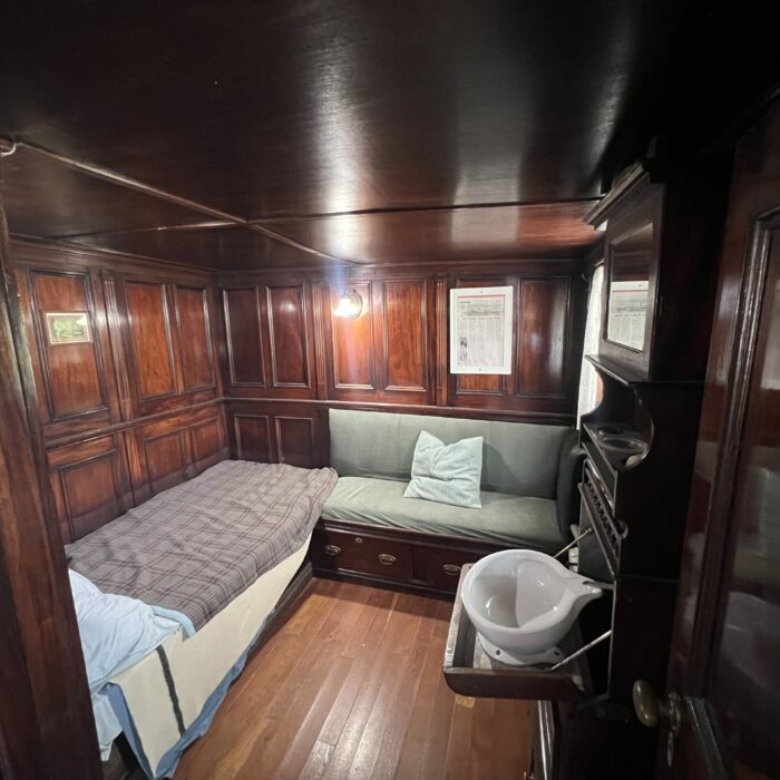 C. G. S. Bradbury Bedroom, 2026, Selkirk Museum Collection Colour photo of a wood paneled bedroom inside a ship