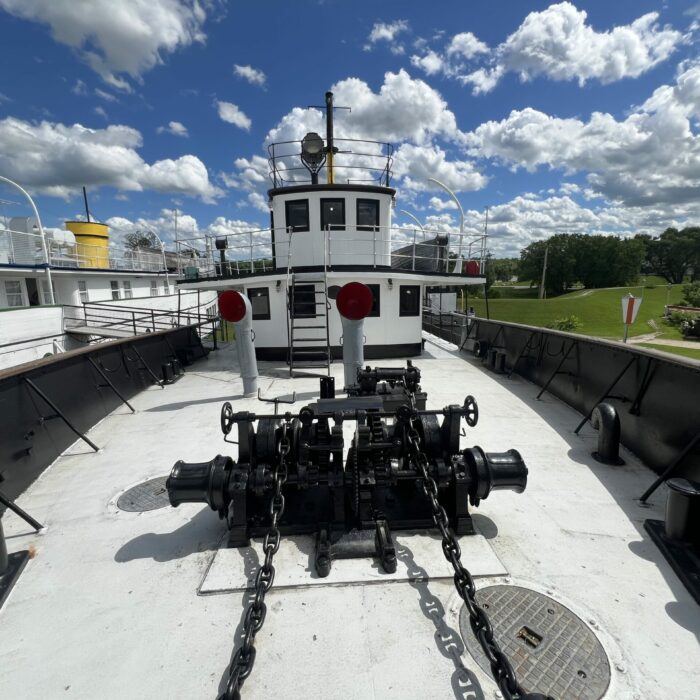 C. G. S. Bradbury Exterior Boat Top, 2026, Selkirk Museum Collection Colour photo of the top deck of the Bradbury. The sky is blue and filled with clouds