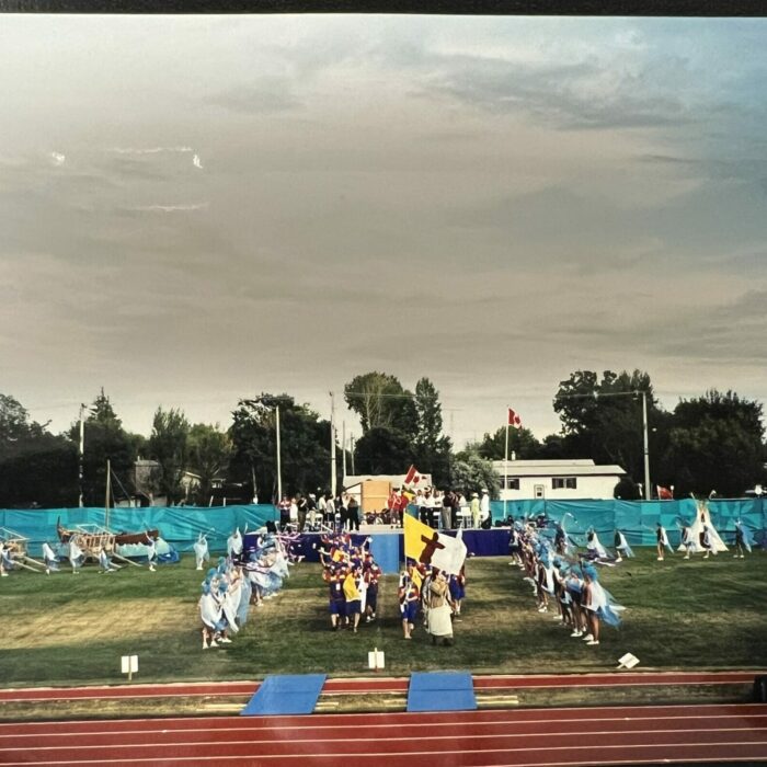 Colour photo of a ceremony on the track