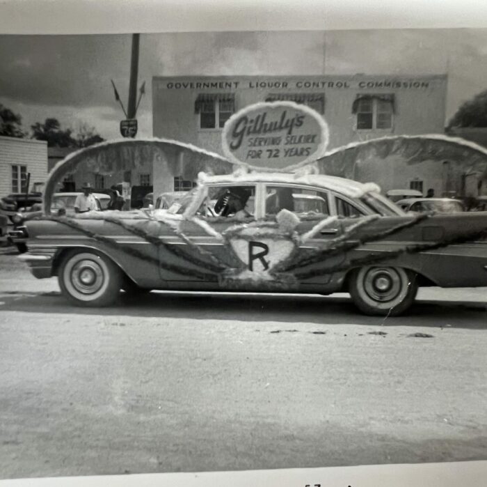 Decorated Car for Gilhuly's, Date Unknown, Selkirk Museum Collection black and white photo of a decorated car for the parade