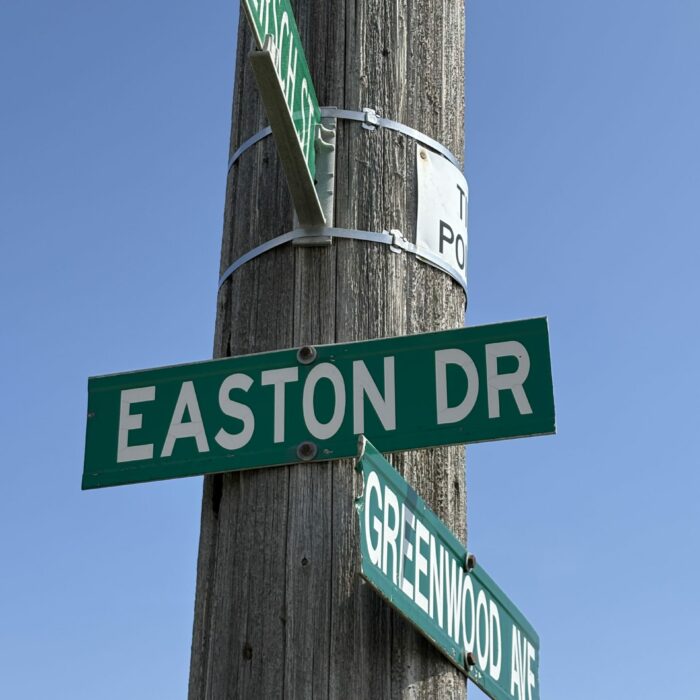 Easton Dr., 2026, Selkirk Museum Collection Colour photo of a street sign on a wooden post. The sign reads 'Easton Dr'