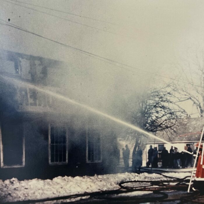 Eveline Hotel Fire with Fire Truck Putting out the Flames, 1970, Selkirk Fire Department Firemen and FIre trucks actively trying to put out the flames from the Eveline Hotel