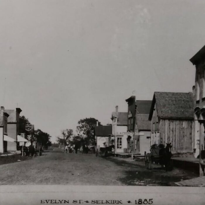 Eveline Street, 1885, University of Manitoba Archive Black and white photo of a street view with buildings down either side of the street