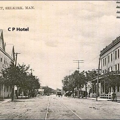 Eveline Street View of the Merchant Hotel and Eveline Hotel, Date Unknown, Source Unknown Sepia-coloured photo of a street-view. In the photo is the Merchant's Hotel and the Eveline Hotel