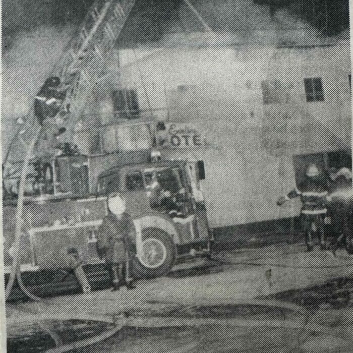 Fireman trying to put out the Eveline Hotel Fire, 1970, Rob Scherza Fire trucks infront of the Eveline Hotel during the Eveline Hotel Fire in 1970