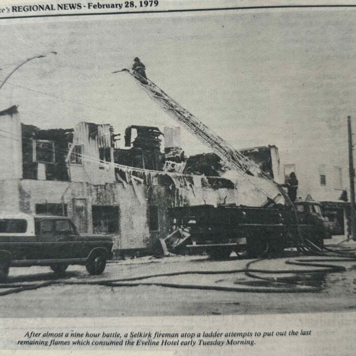 Firemen on a ladder for the Eveline Hotel Fire, 1979, Interlake Regional News A fireman on a ladder in front of the Eveline Hotel