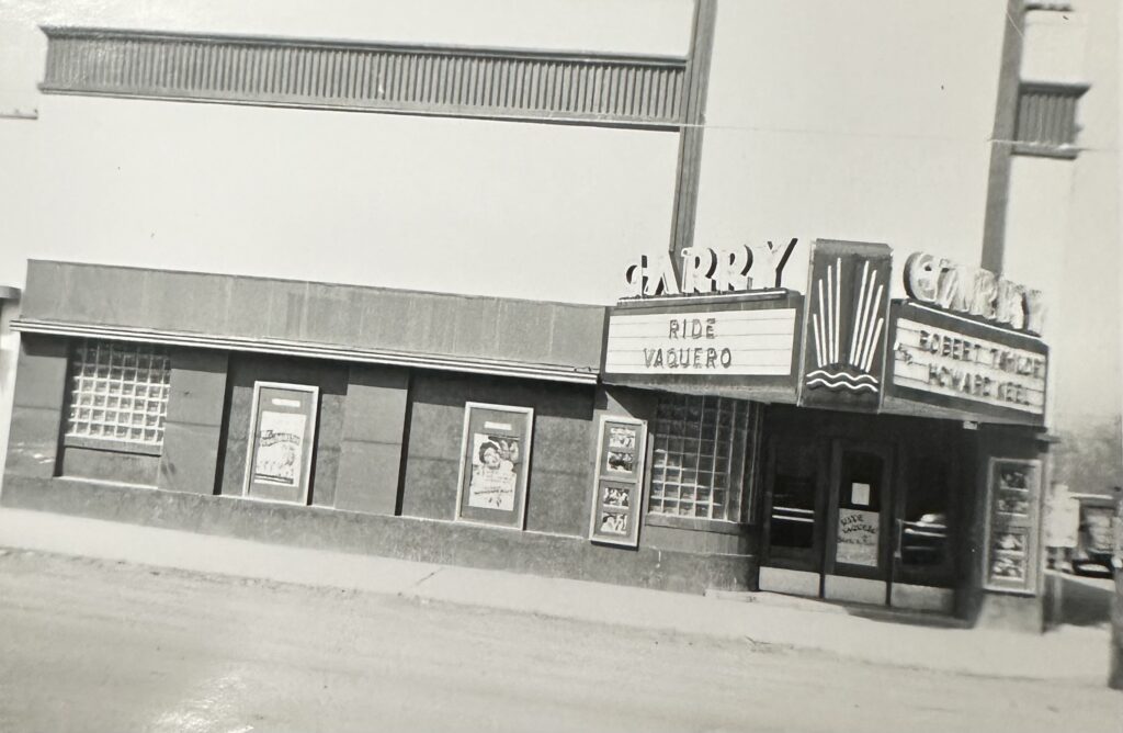 A black and white photo of the entrance of the Garry Theatre