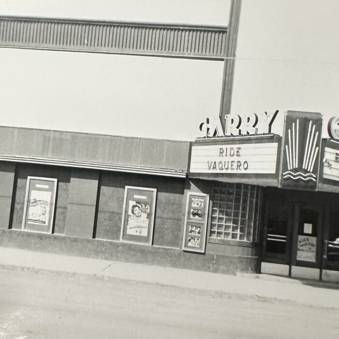 A black and white photo of the entrance of the Garry Theatre