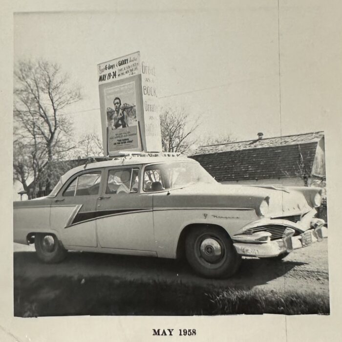 A black and white photo of a parked car