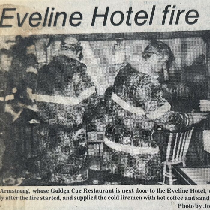Golden Cup Restaurant Opens for Firefighters to have Coffee and Sandwiches all Night, 1970, Joy Laye Two firemen in their gear are eating at a restaurant