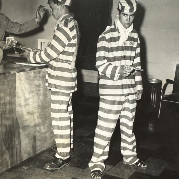 2 men in jail prisoners costumes to promote the Jail House Rock Movie premiering at the Garry Theatre