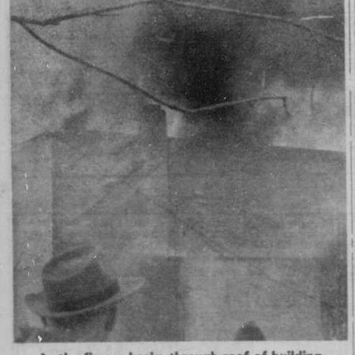Black and white photo of the caved roof of the Garry theatre after the fire