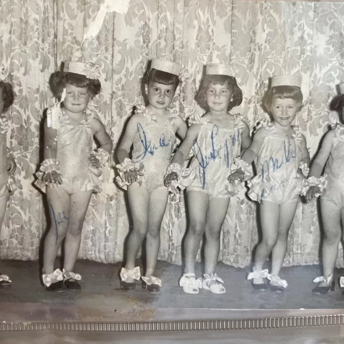 A group of young girls dancing on stage