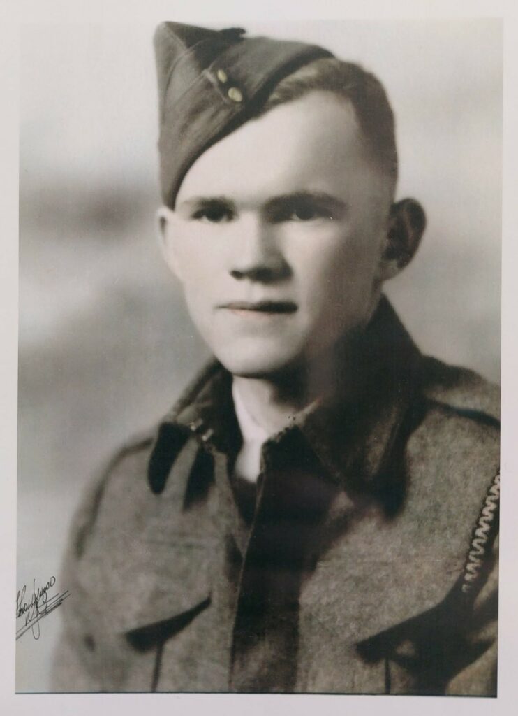 Black and white photo of a man in military uniform