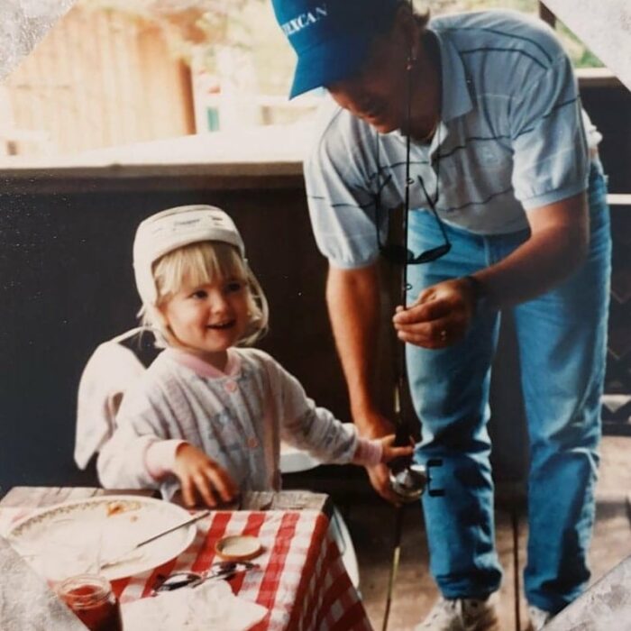 Coloured portrait of a Chuck's young daughter holding her first fishing rod