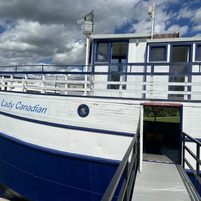 Lady Canadian Entrance, 2026, Selkirk Museum Collection Colour photo of the exterior of a ship. The Lady Canadian is white and blue and has an upper deck