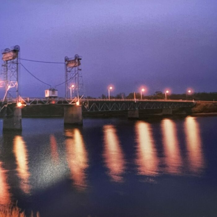 Lift Bridge Light Reflects Off River, 2001, Selkirk Museum Collection Lift bridge at night, the light from the bridge is reflecting off the river.