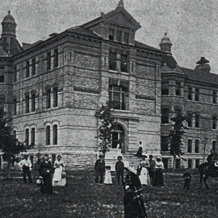 Manitoba Asylum, Date Unknown, Selkirk Museum Collection A black and white photo of the Manitoba Asylum with people standing around the grassy space in front of the building