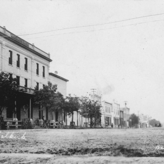 Manitoba Ave, Date Unknown, George Alfred Barrowclough A black and white photo of Manitoba Avenue. The Merchant's Hotel is on the left side of the image