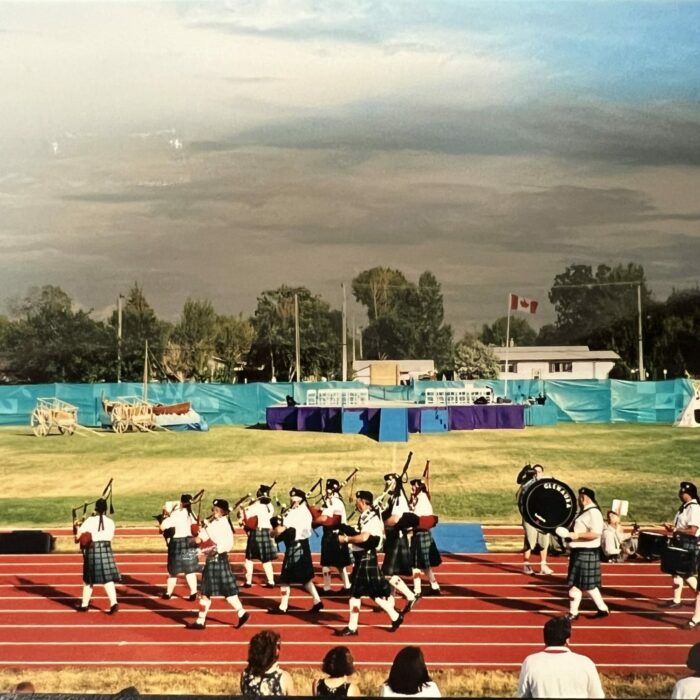 Color photo of marching band walking on the track
