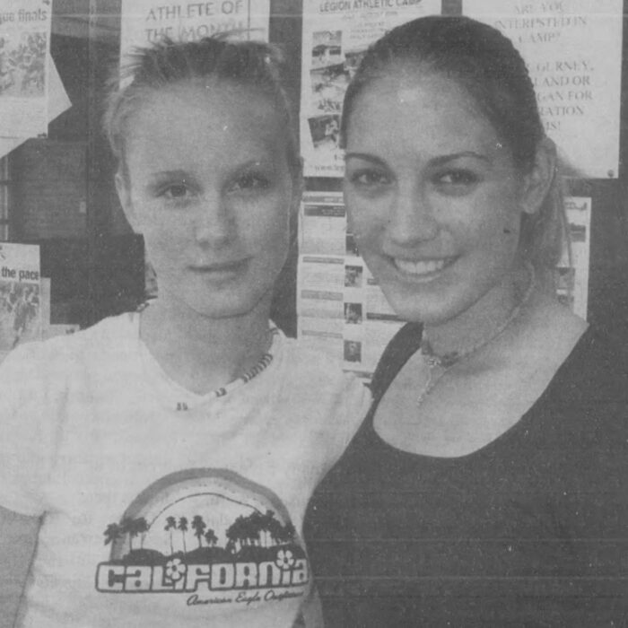 Two women pose for photo