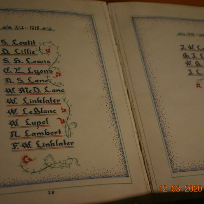 Colour photo of a book with names handwritten in it