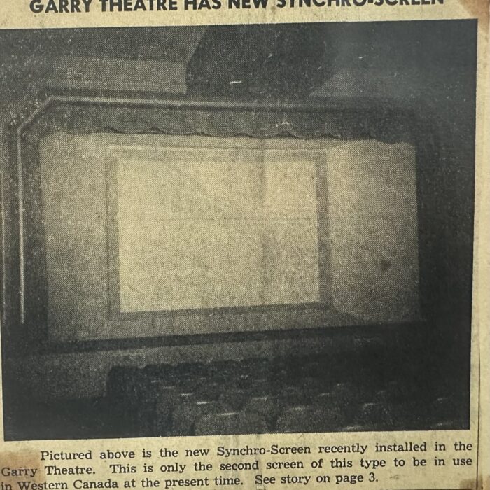 Black and white photo of the new synchro-screen recently installed into the Garry theatre