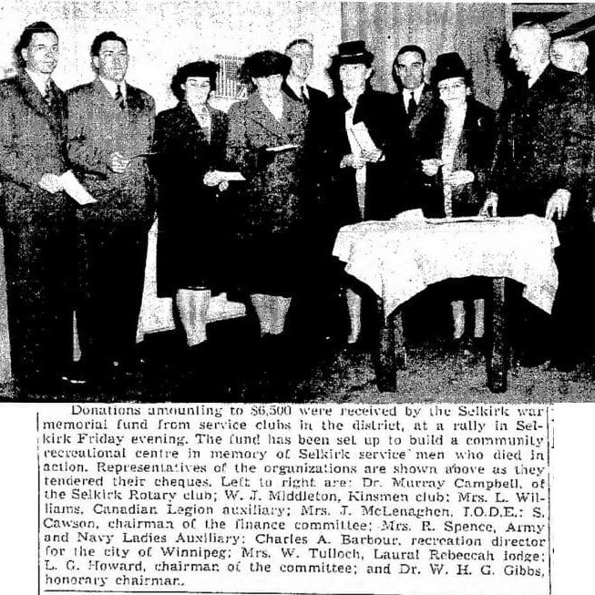 Donations being received by the Selkirk War Memorial committee.