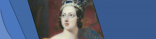 Queen Headerbar This is a picture of Queen Victoria. She is wearing a gold gown and a red and silver crown. She is pale with brown hair that is short.