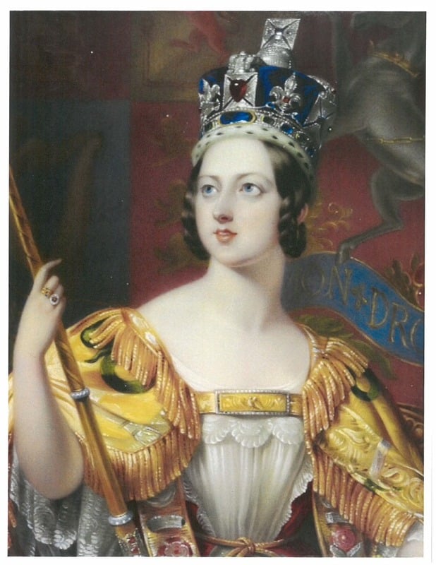 Photo of Queen Victoria holding a staff, wearing a yellow dress, with a blue royal piece of headwear on