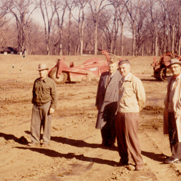 Rotary Pool Excavation Ted Purvis, John Rokosh, Sam Anderson, Sid Sarbit, DR McLeod, 1958, Fraser Stewart Sepia-coloured photo of a few men standing in an open grassy space