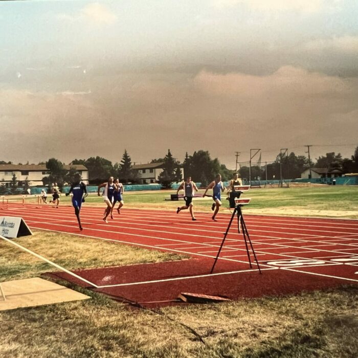 Color photo of people running on the track