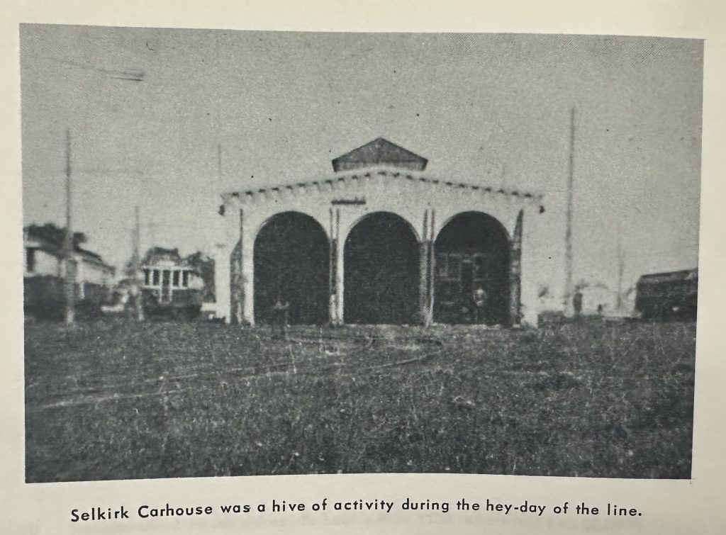 Black and white photo of the Selkirk carhouse. Underneath the photo is text reading " Selkirk Carhouse was a hive of activity during the hey-day of the line".