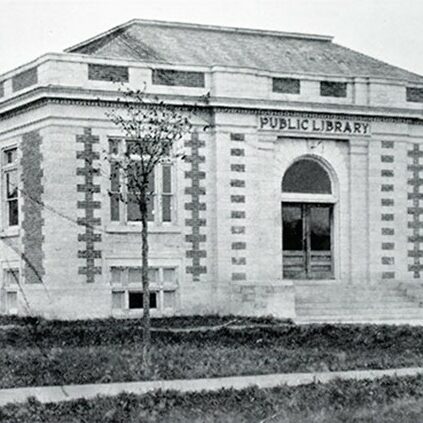 Selkirk Public Library, 1913, Archives of Manitoba A black and white image of a large white brick classical style building. The words "Public Library" are above the arched front door
