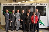 City of Selkirk Council at the Selkirk Transit operations garage standing in front of the Selkirk Transit bus