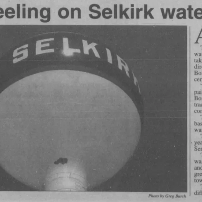 Newspaper article titled paint peeling on Selkirk water tower