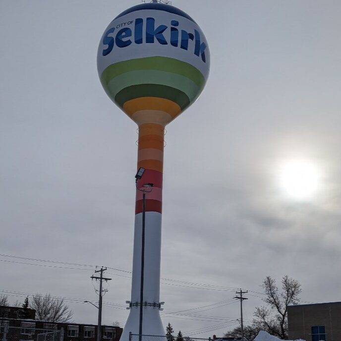 Selkirk water tower with new paint job from 2023 on a cloudy day