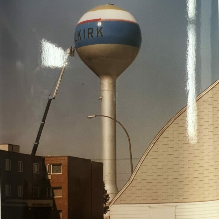 Water tower thats painted red blue and white