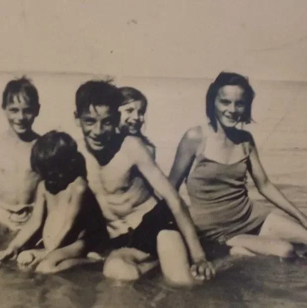 The Youngest of the Langlois Family in Hecla just before moving back to Selkirk at war time, Date Unknown, Jock Langlois Black and white portrait of five children lounging in Hecla beach