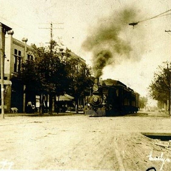 Image of a train travelling down Eveline street in Selkirk in 1906.
