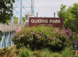 Queens Park sign in front of Selkirk's iconic blue bridge.