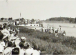 The Selkirk Park banner showing people on the shoreline of Selkirk Park watching boats pass by on the water